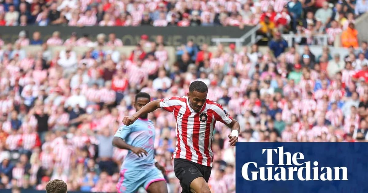 Player dribbling the ball in front of fans Player dribbling the ball in front of fans
