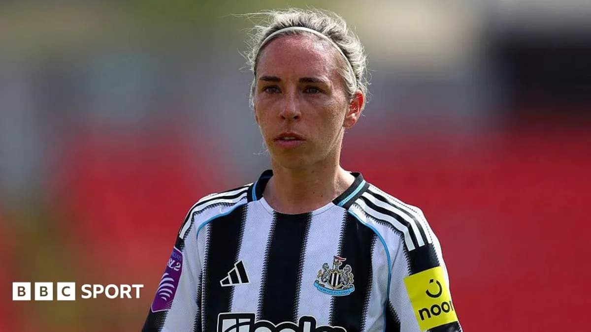 Female player in Newcastle United kit on field Female player in Newcastle United kit on field