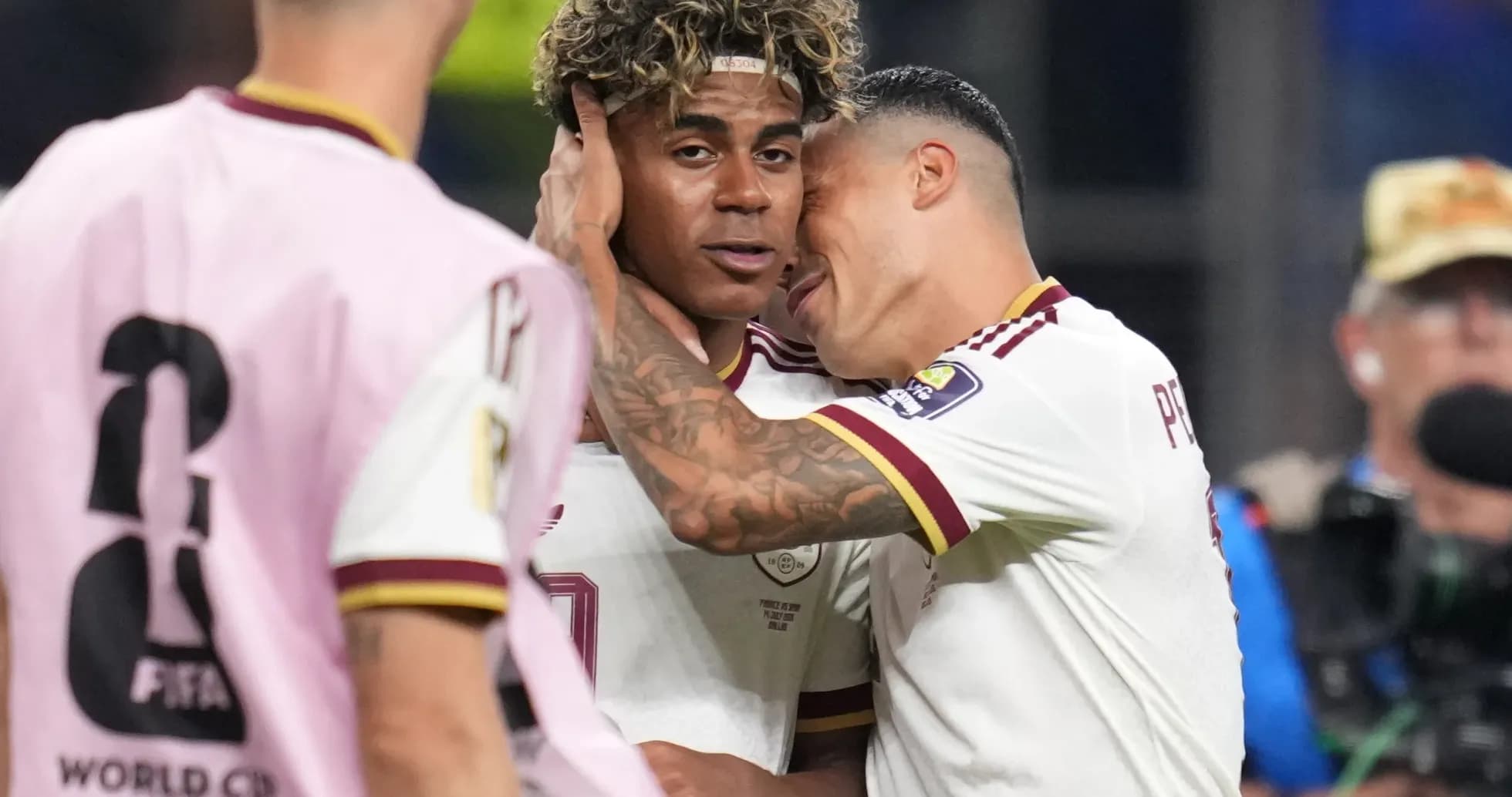 Two players celebrating during World Cup match Two players celebrating during World Cup match