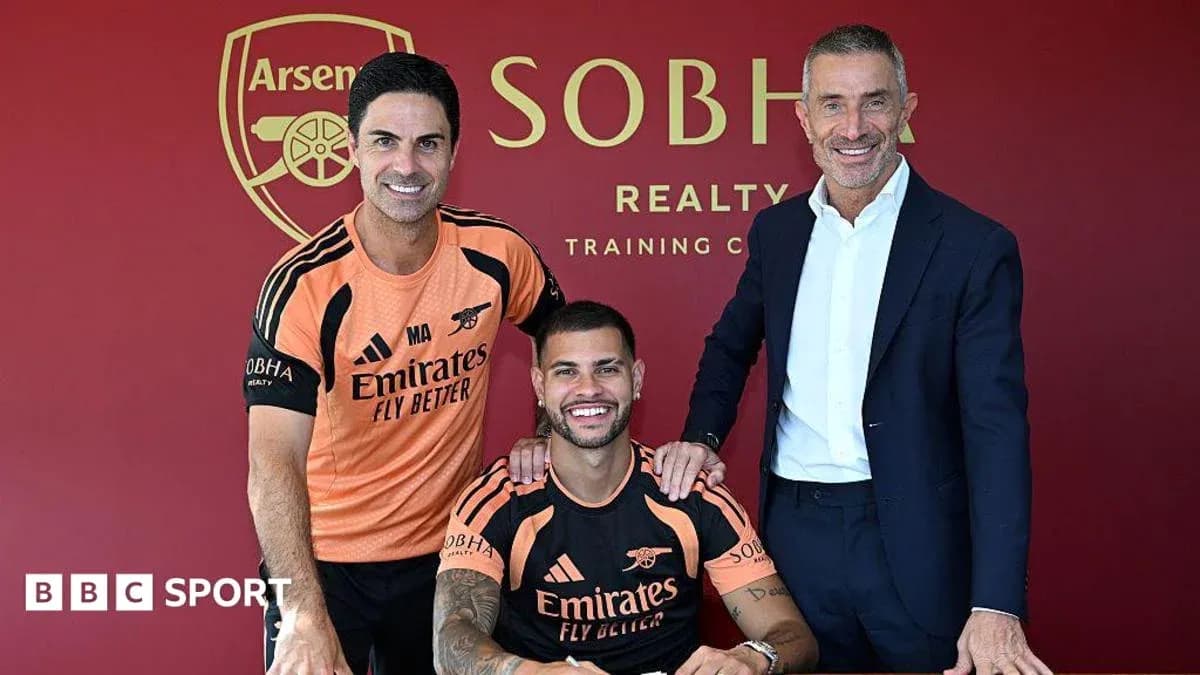 Manager and players posing at Arsenal training facility Manager and players posing at Arsenal training facility