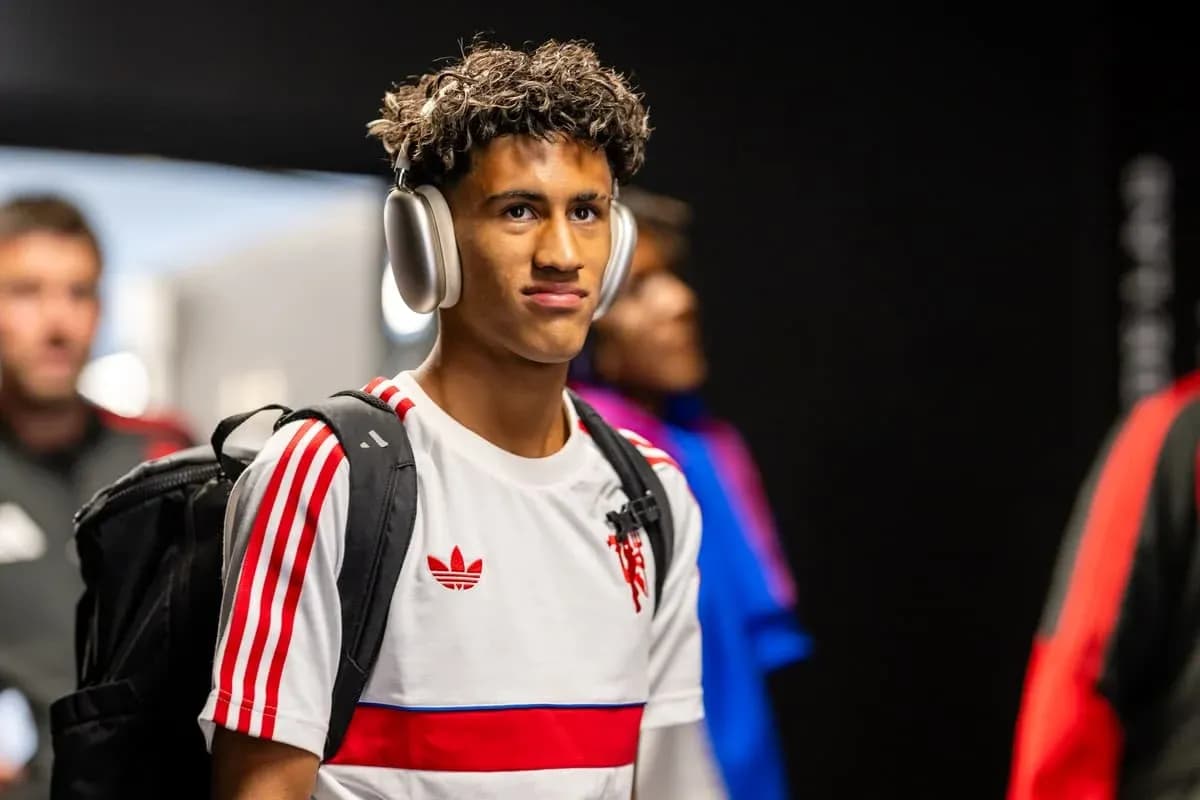 Player entering venue wearing headphones and backpack Player entering venue wearing headphones and backpack