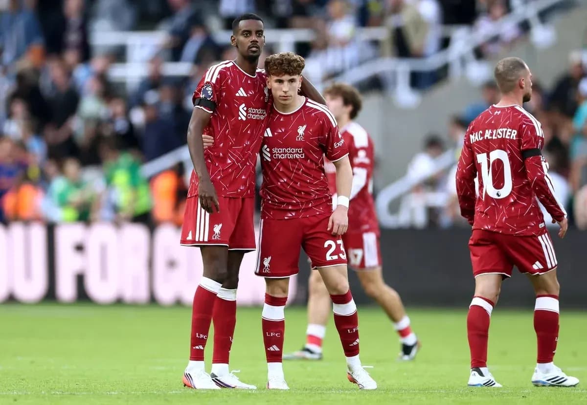 Liverpool players in red kits during match Liverpool players in red kits during match