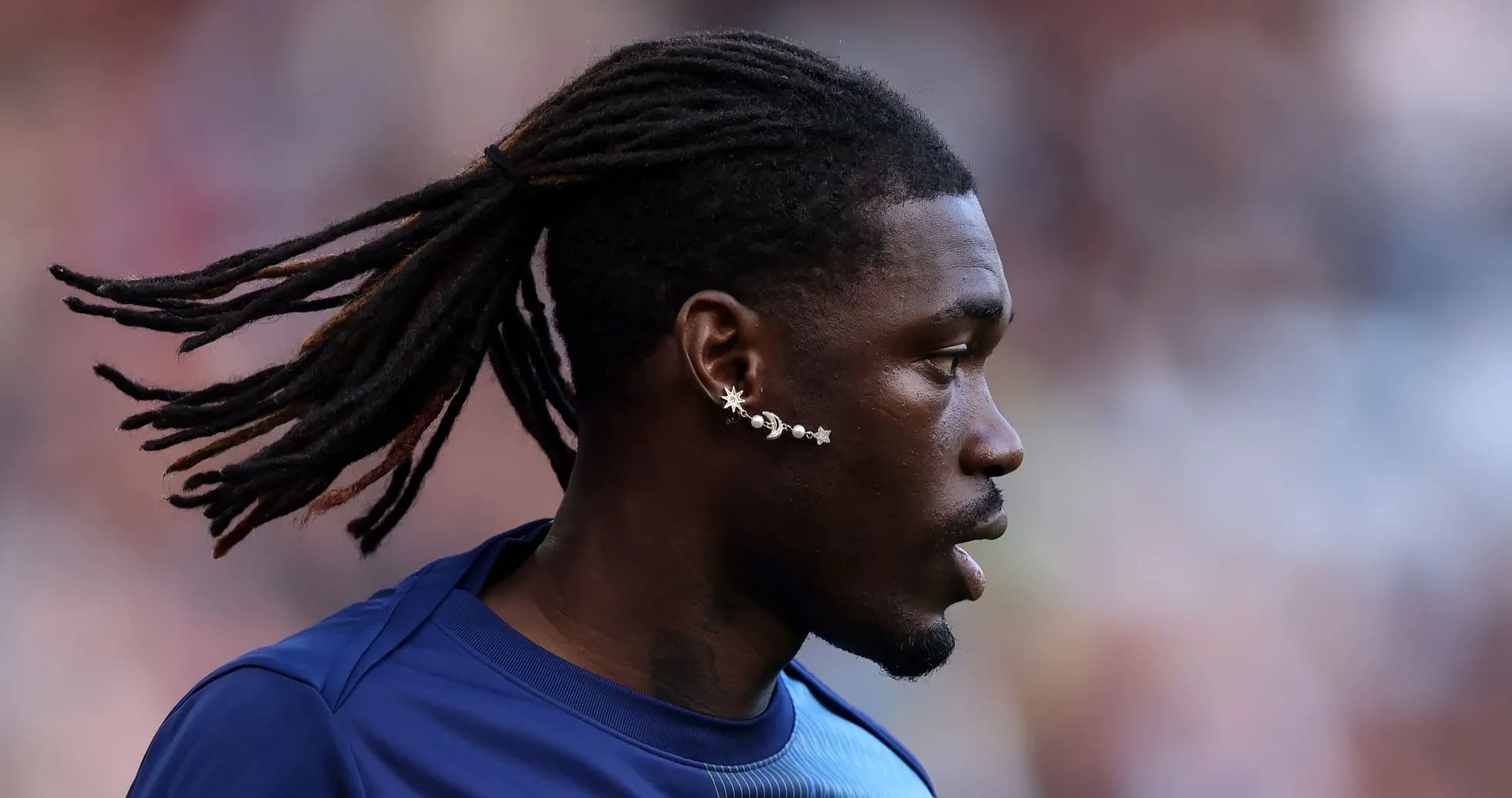 Player with dreadlocks during match warm-up Player with dreadlocks during match warm-up