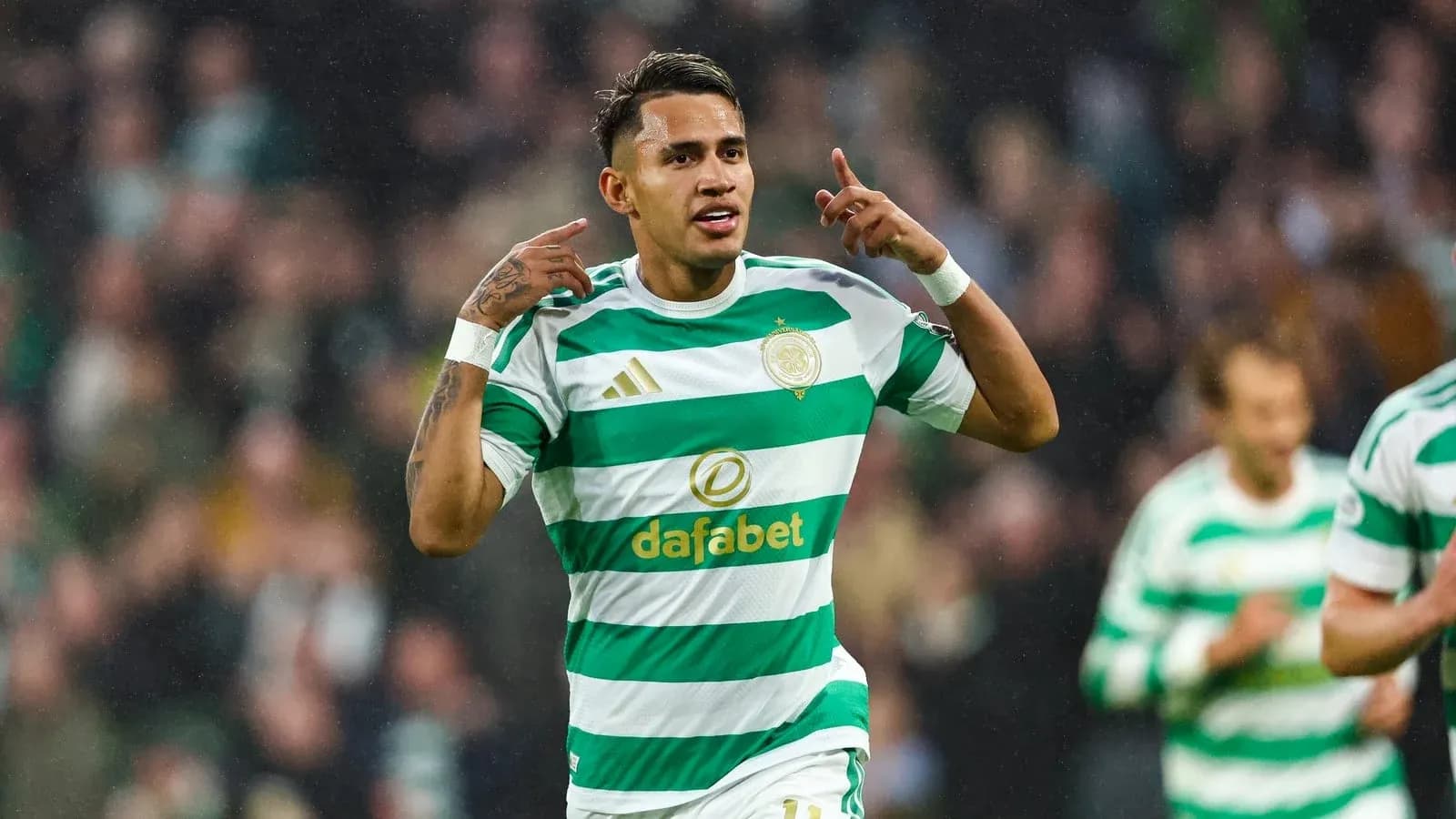 Player celebrating goal in Celtic kit during match Player celebrating goal in Celtic kit during match