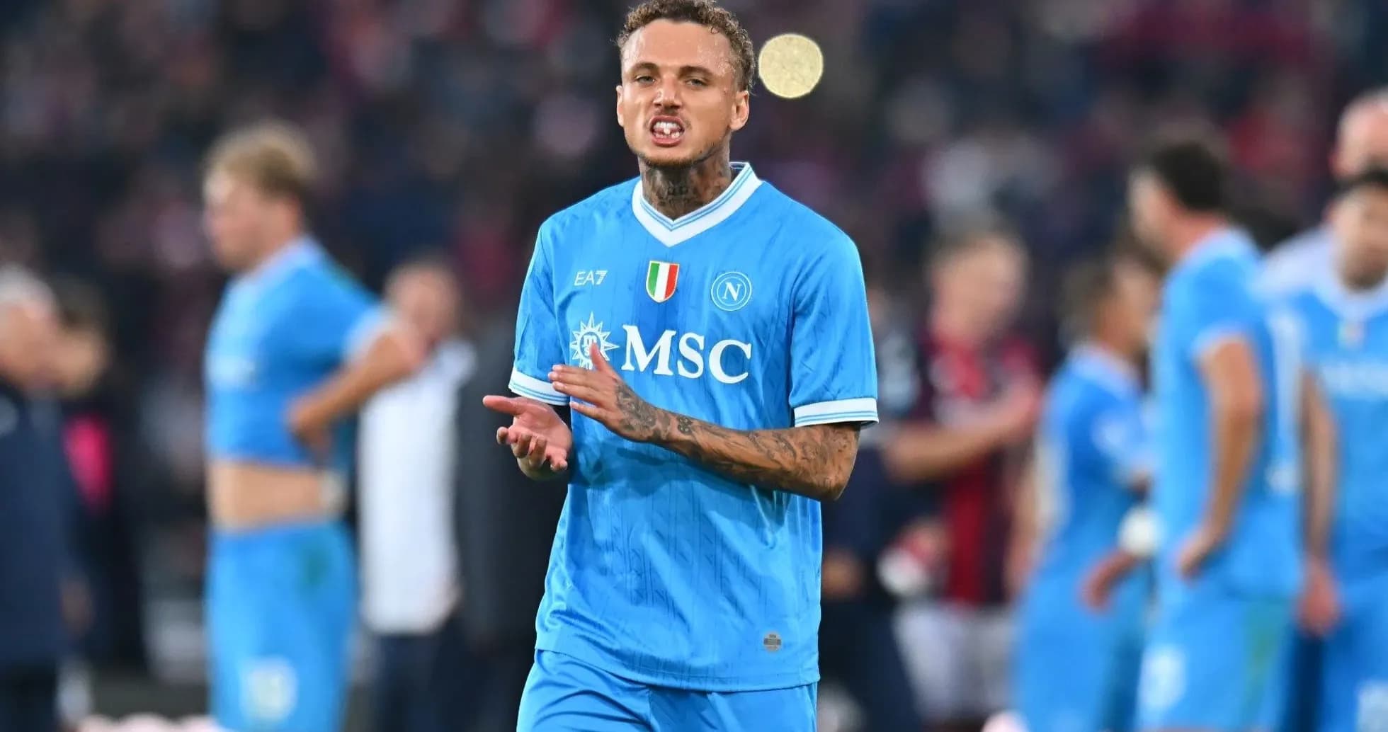 Player in blue Napoli jersey reacting on the field Player in blue Napoli jersey reacting on the field
