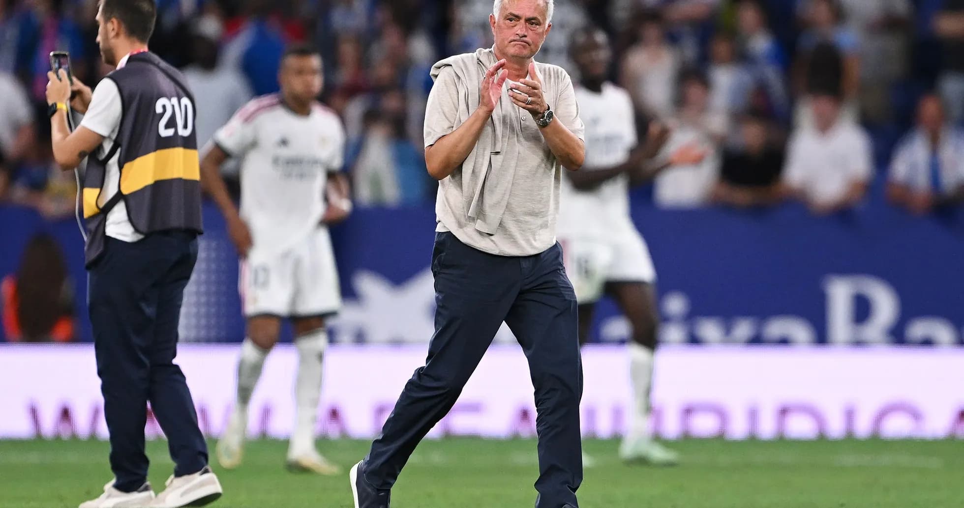 Manager applauding on the sidelines during match Manager applauding on the sidelines during match