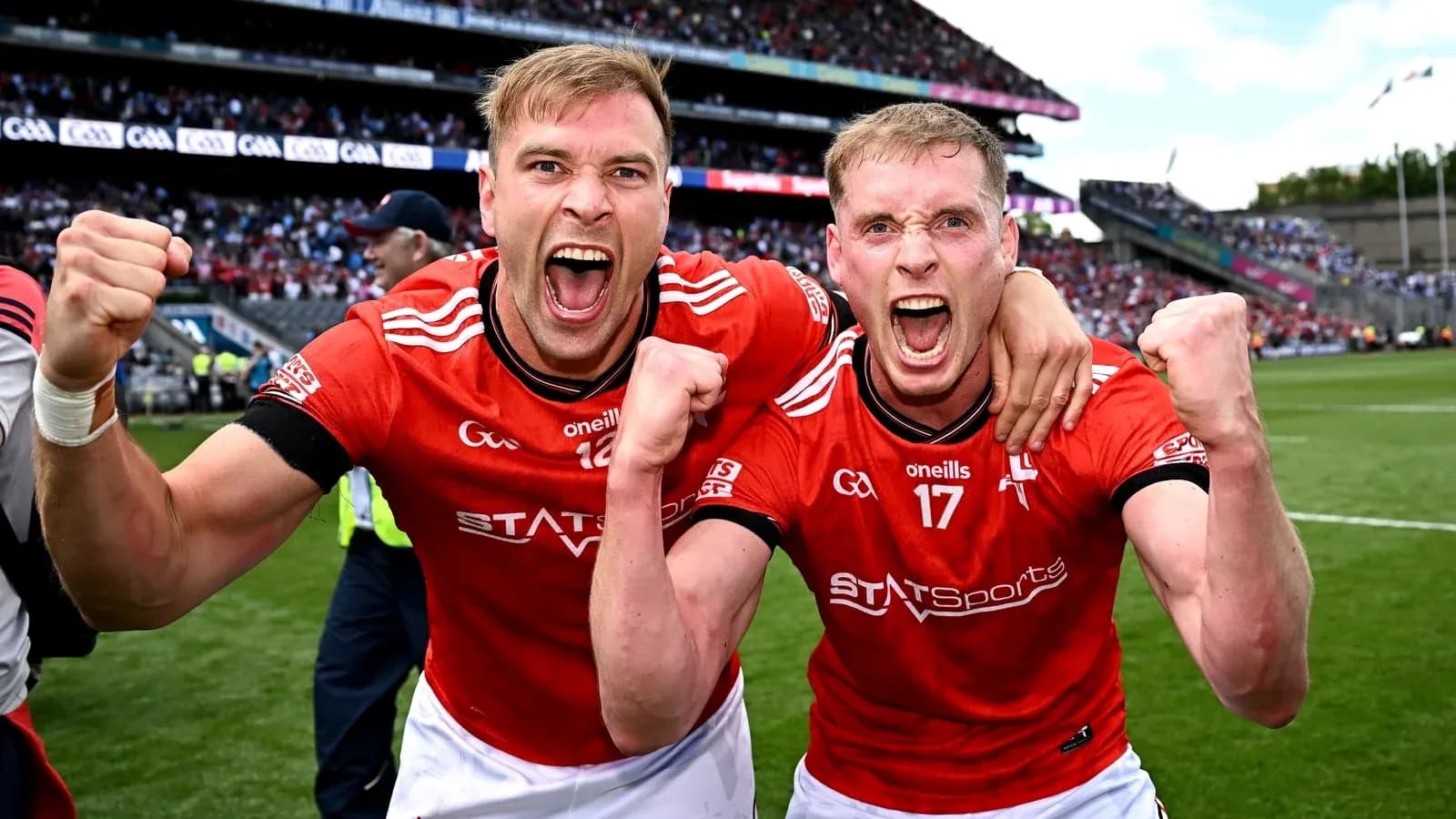 Two players celebrating victory on the field Two players celebrating victory on the field