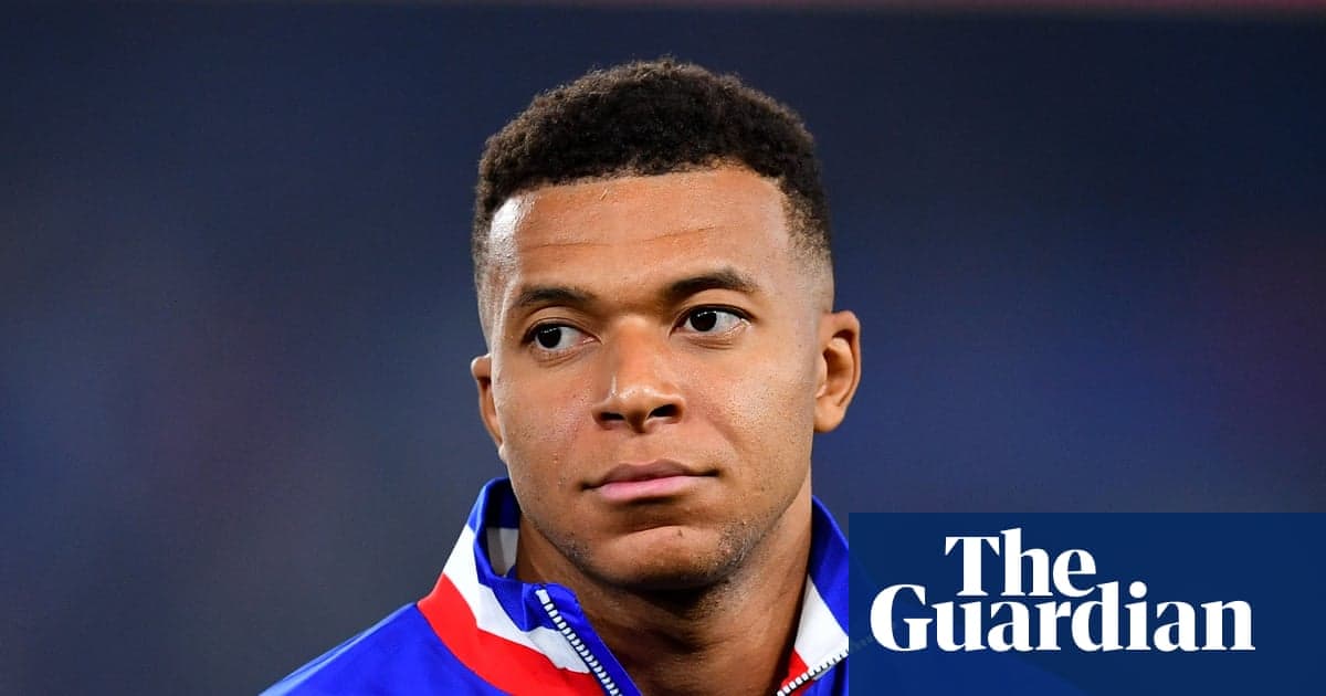 Football player wearing team jacket, looking serious Football player wearing team jacket, looking serious