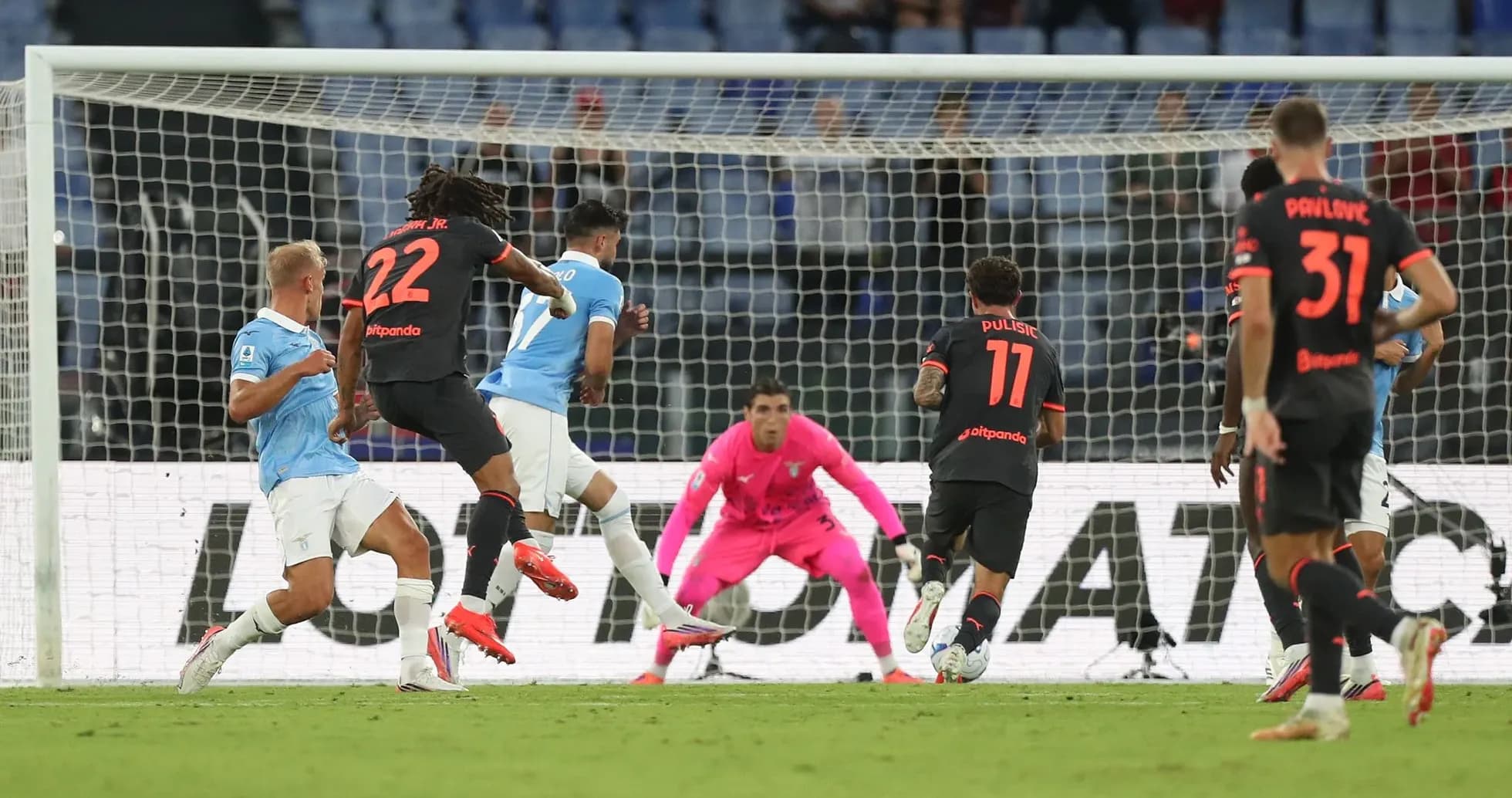 Lazio player attempting to score against AC Milan Lazio player attempting to score against AC Milan