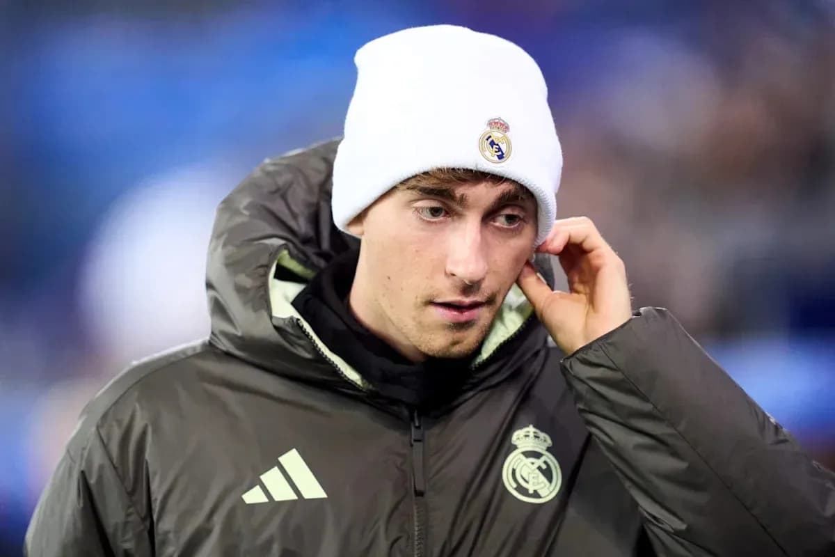 Player in Real Madrid jacket and beanie during match Player in Real Madrid jacket and beanie during match