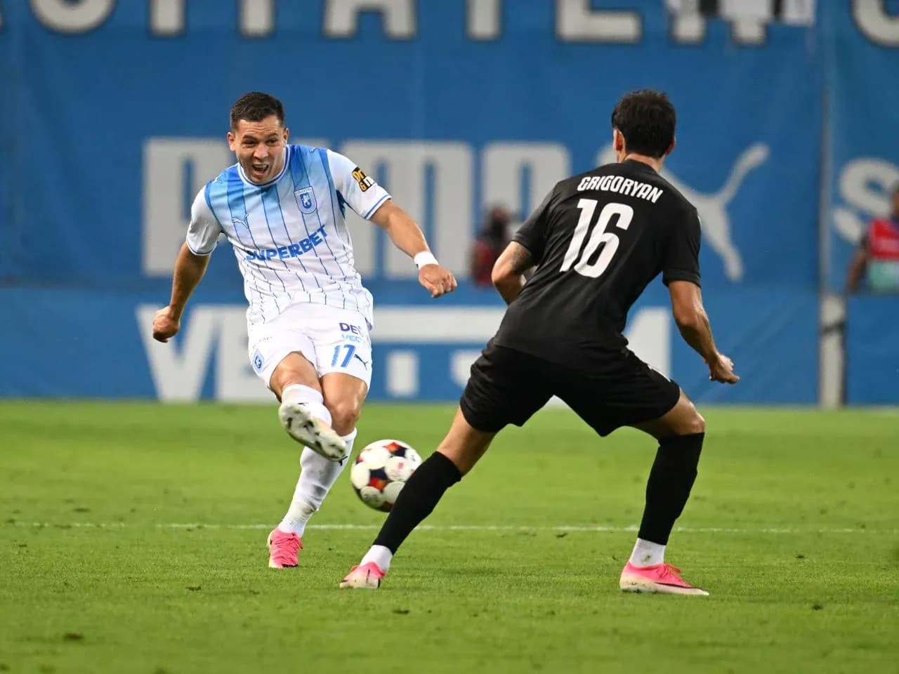 Player challenging for the ball in Europa League match Player challenging for the ball in Europa League match