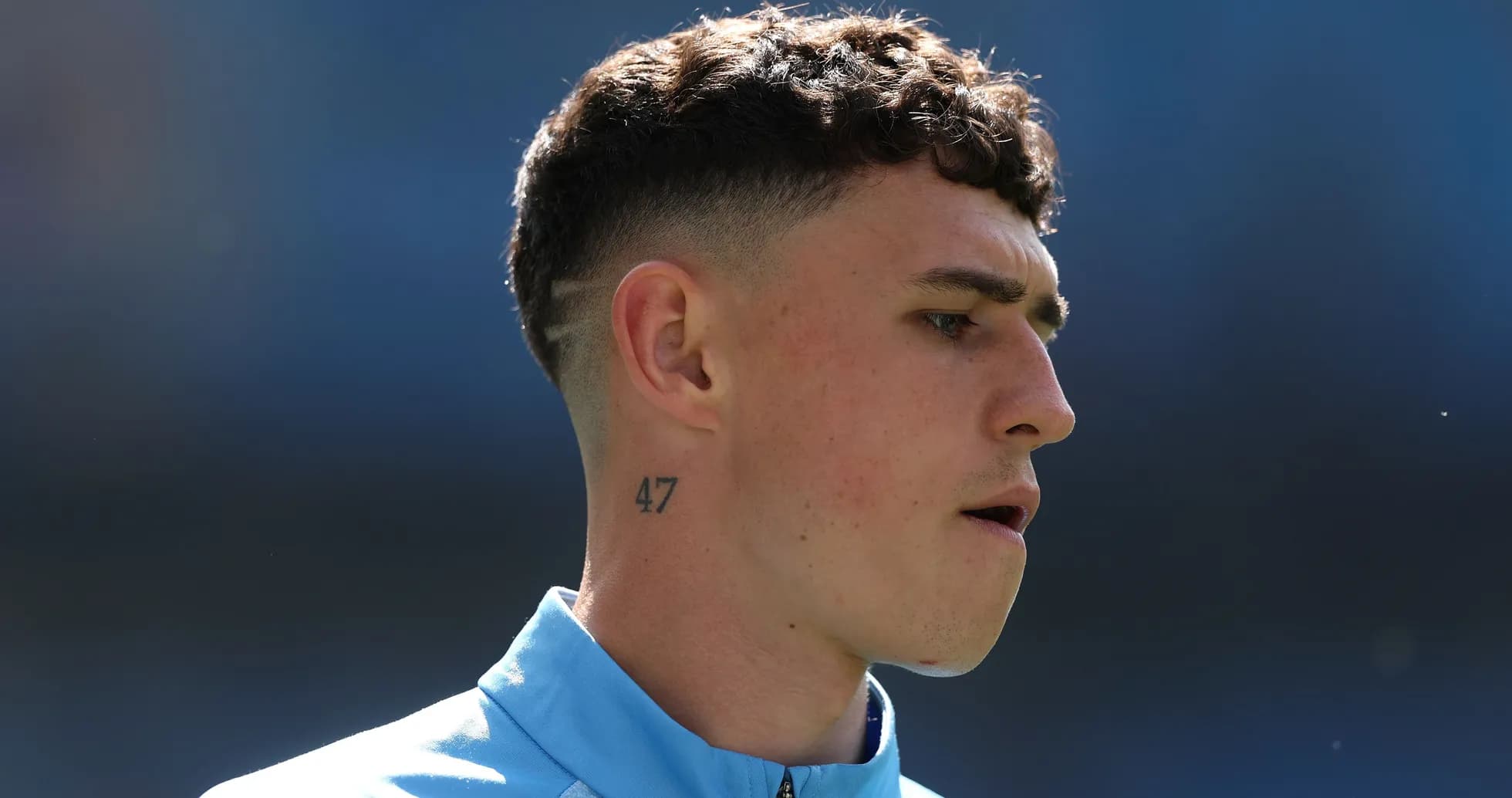 Player with short hair and tattoo during warm-up Player with short hair and tattoo during warm-up