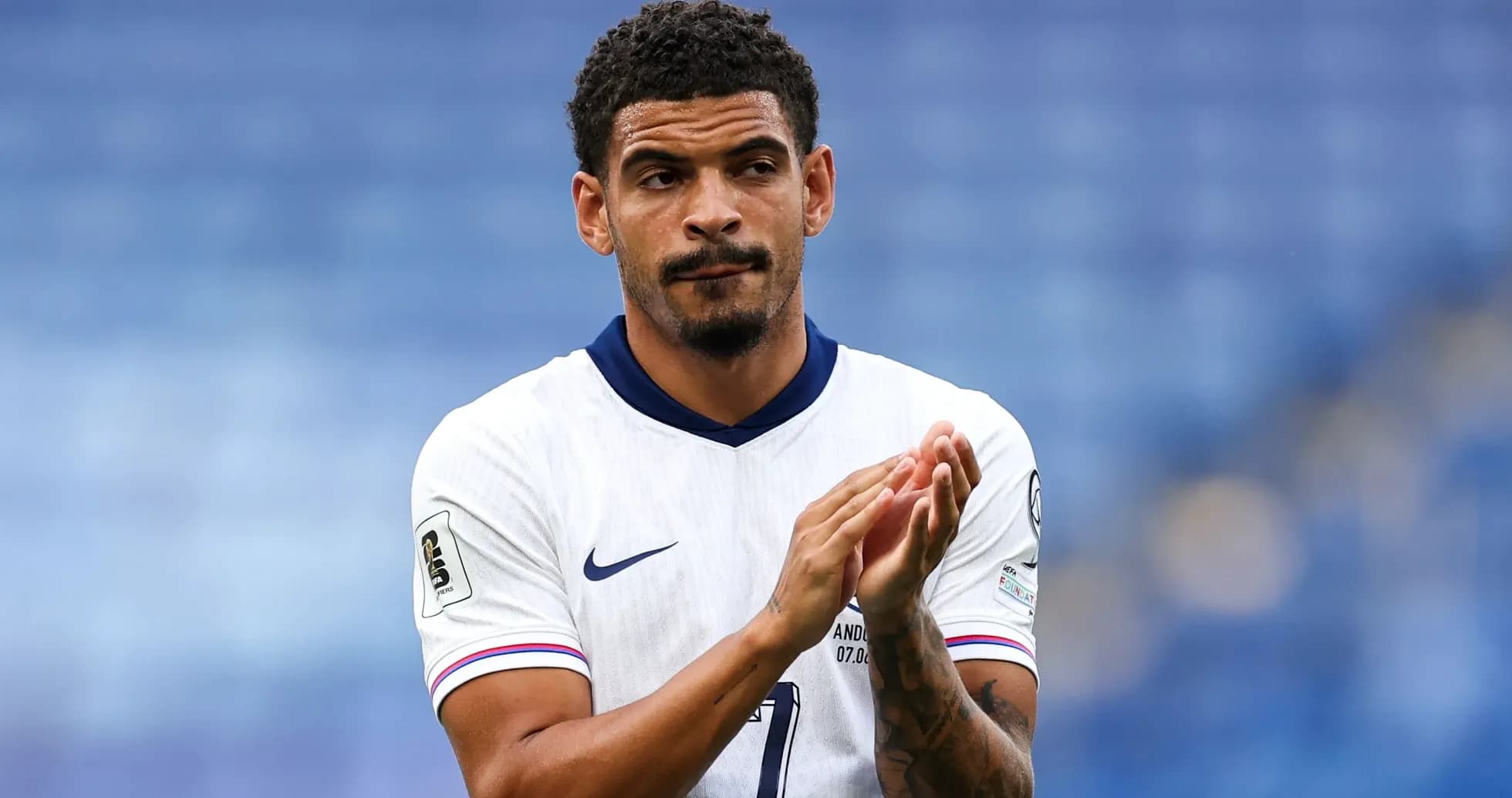 Player applauding while wearing national team jersey Player applauding while wearing national team jersey