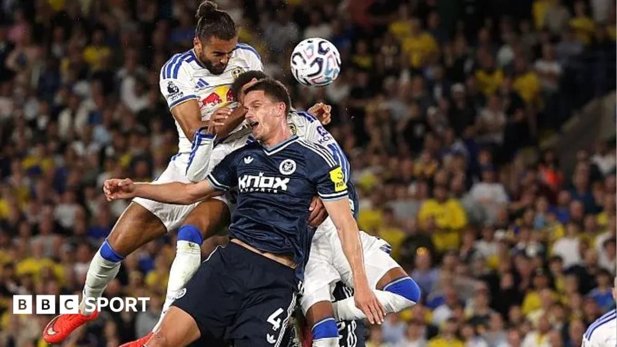 Players competing for the ball during a match Players competing for the ball during a match