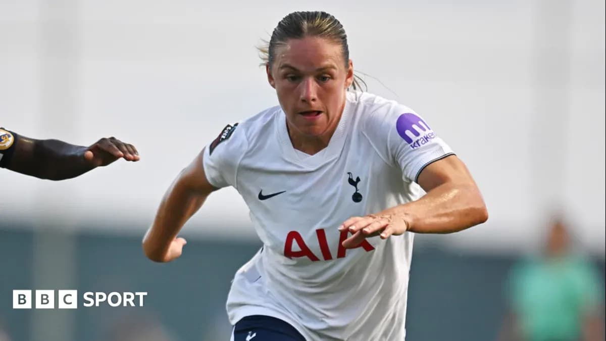 Player running with ball during match for Tottenham Player running with ball during match for Tottenham