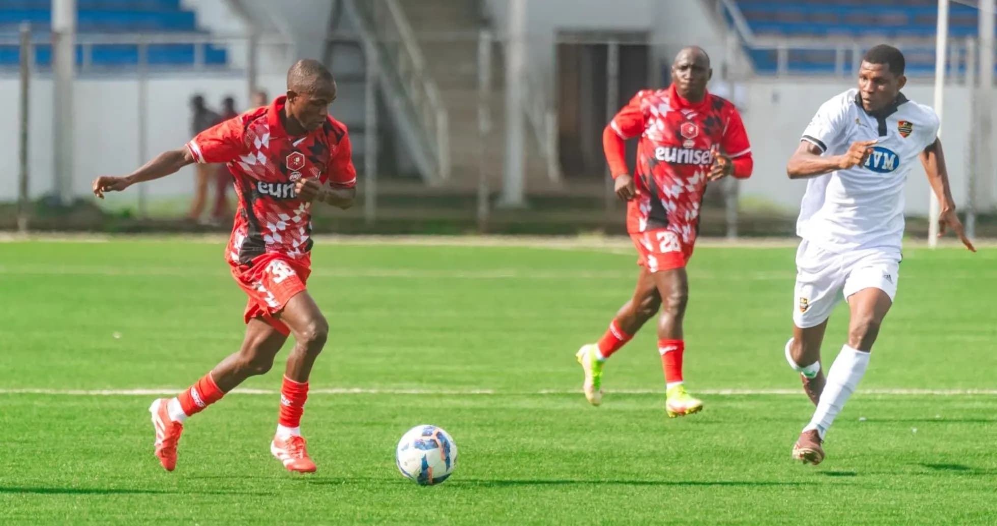 Kano Pillars player dribbling past Doma United players Kano Pillars player dribbling past Doma United players