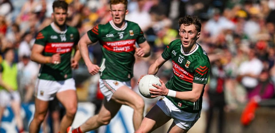 Mayo player running with the ball during match Mayo player running with the ball during match