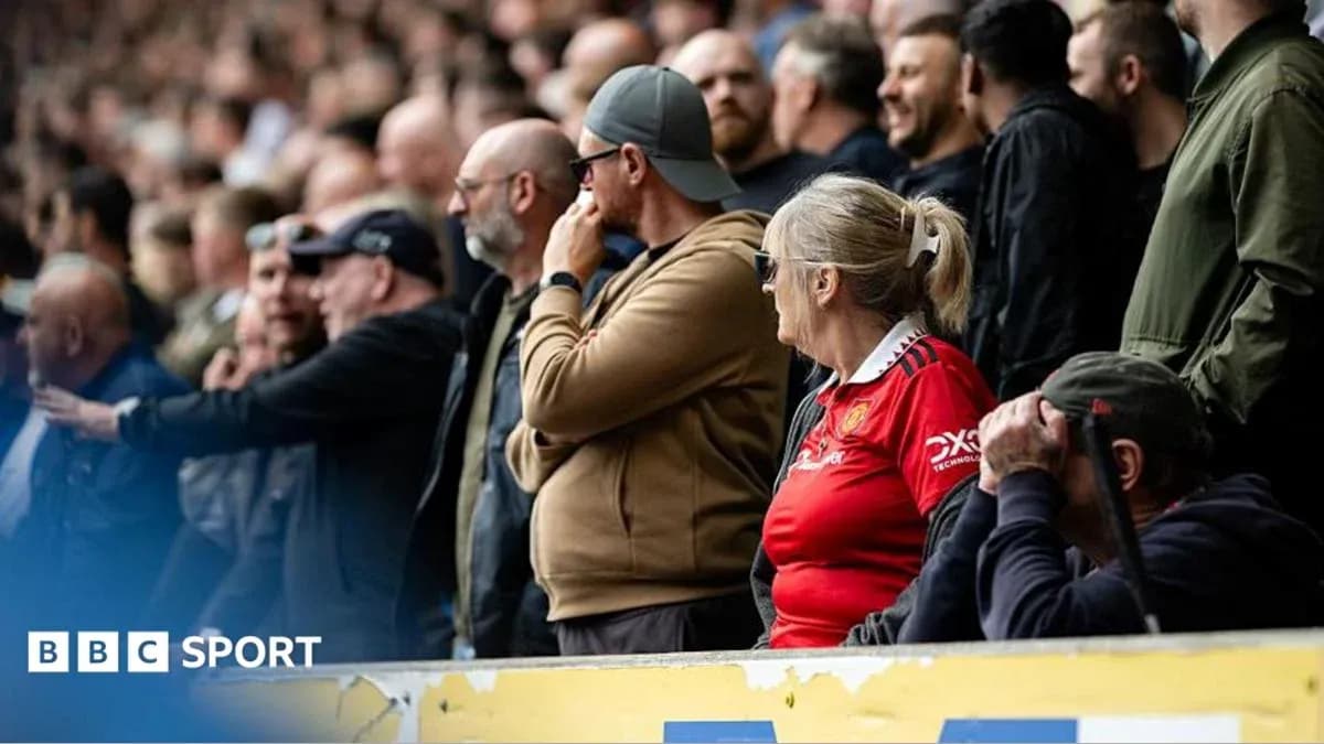 Fans watching the match from the stands Fans watching the match from the stands