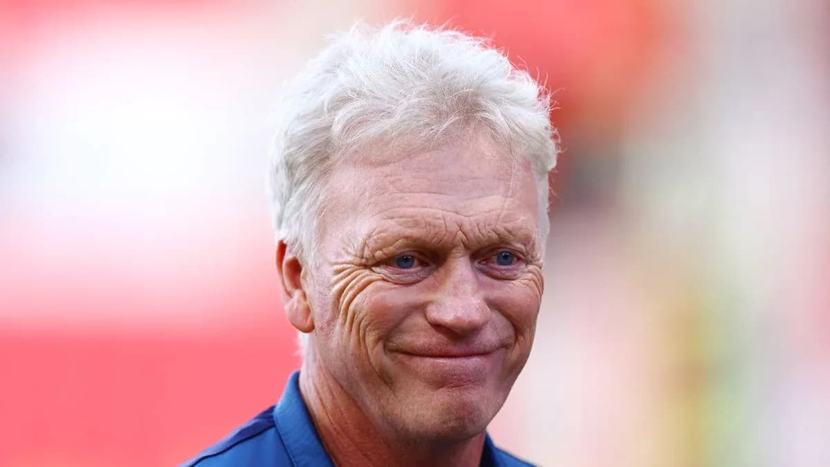 Football manager smiling before a match Football manager smiling before a match
