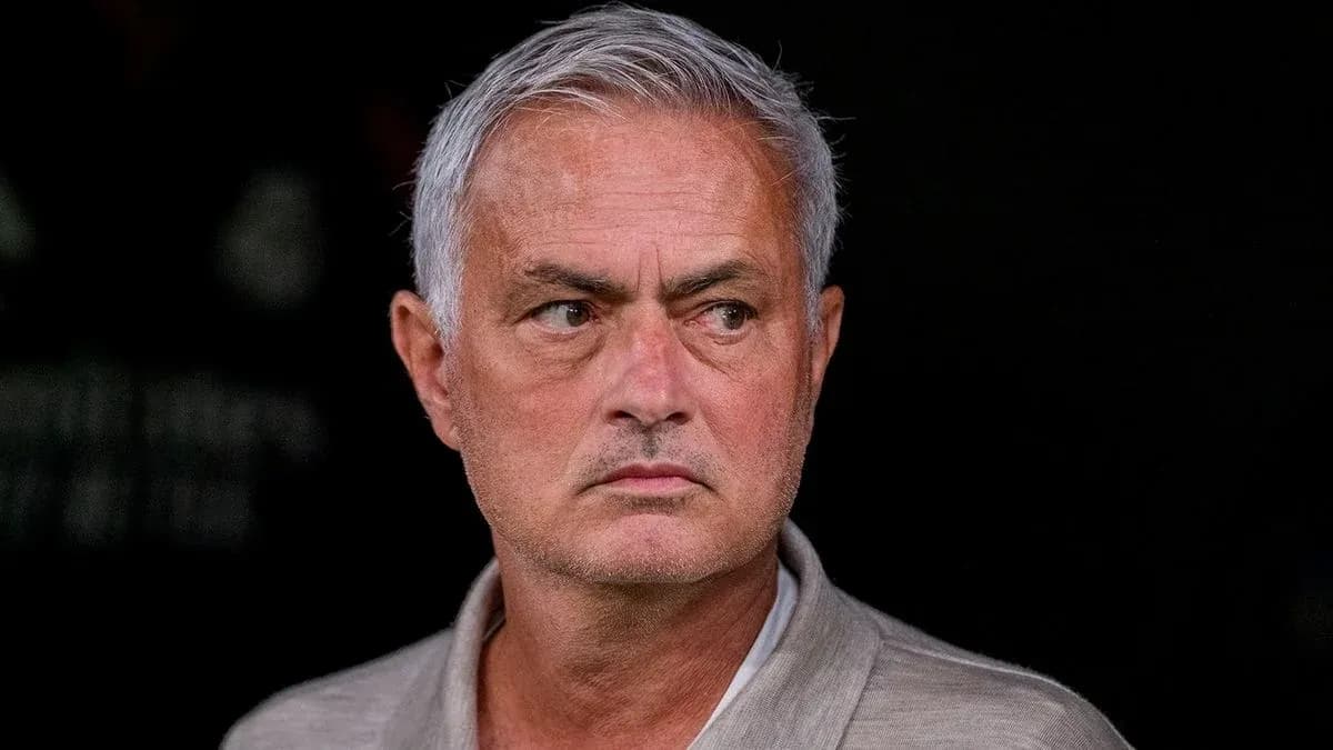 Manager observing from the sidelines during match Manager observing from the sidelines during match