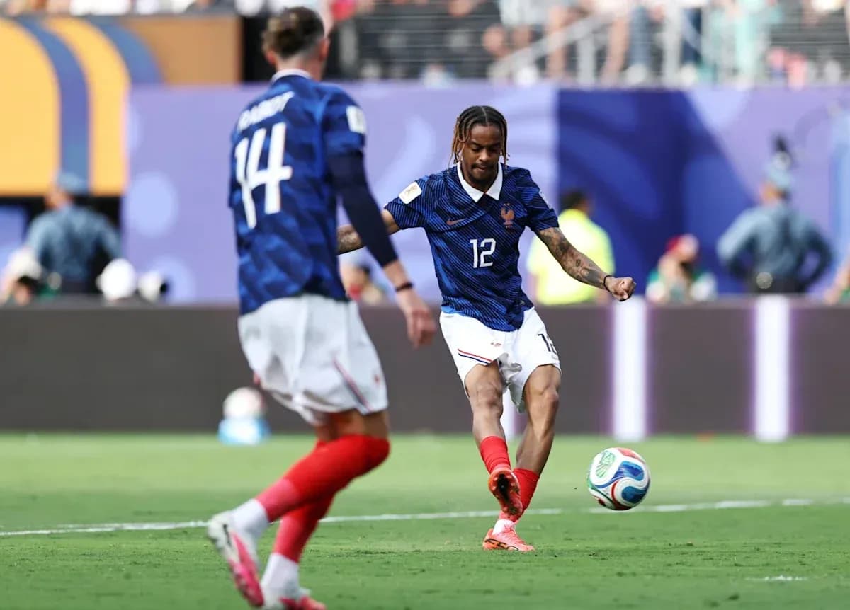 French player kicking soccer ball during match French player kicking soccer ball during match