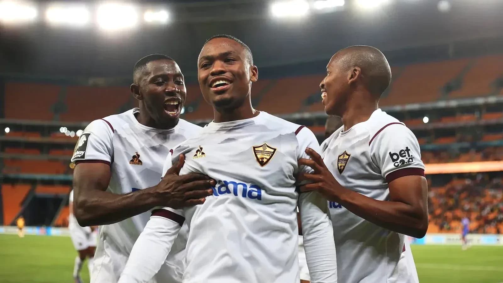 Players celebrating a goal during a match Players celebrating a goal during a match