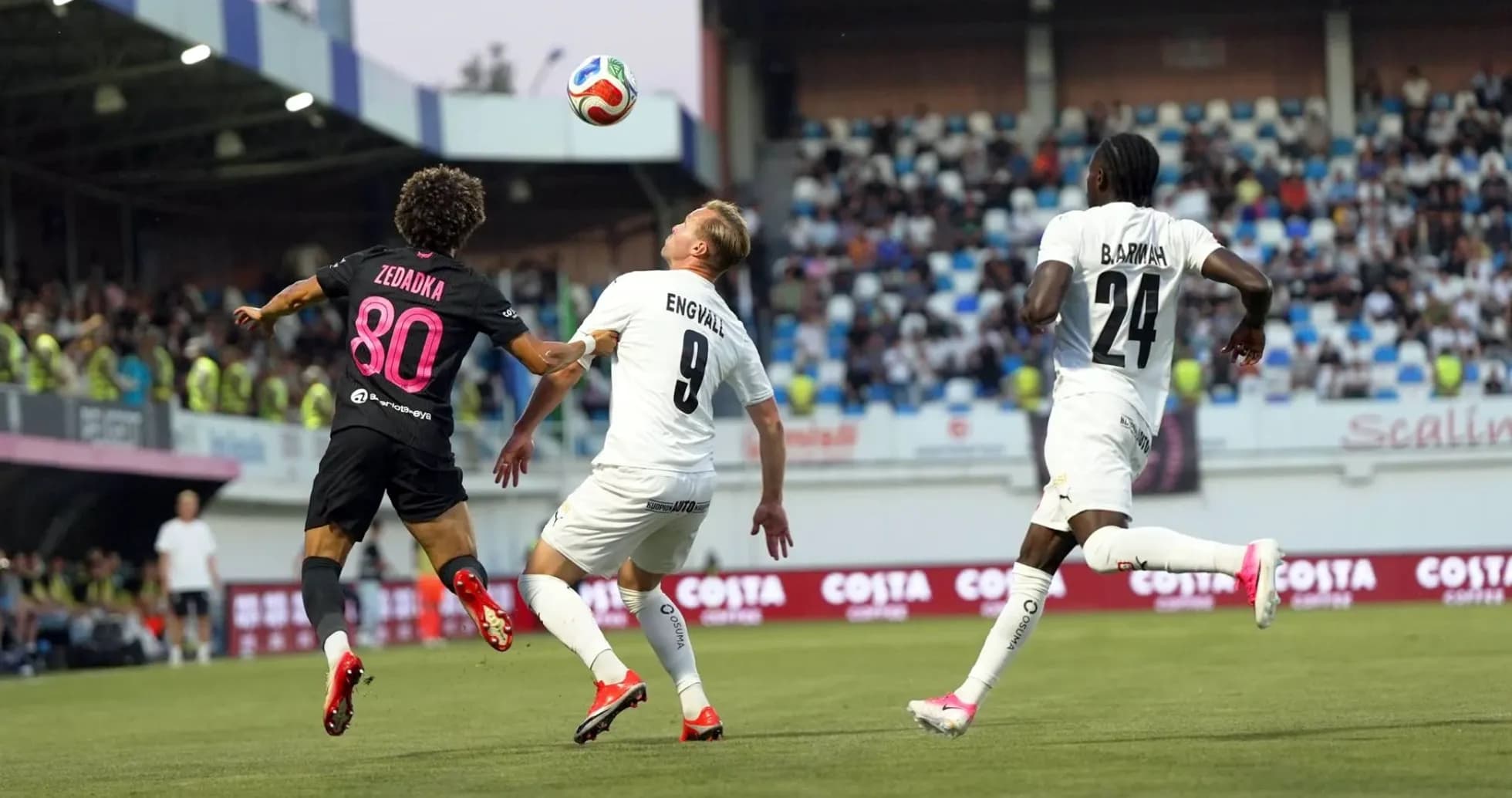 Players contesting for the ball during match Players contesting for the ball during match