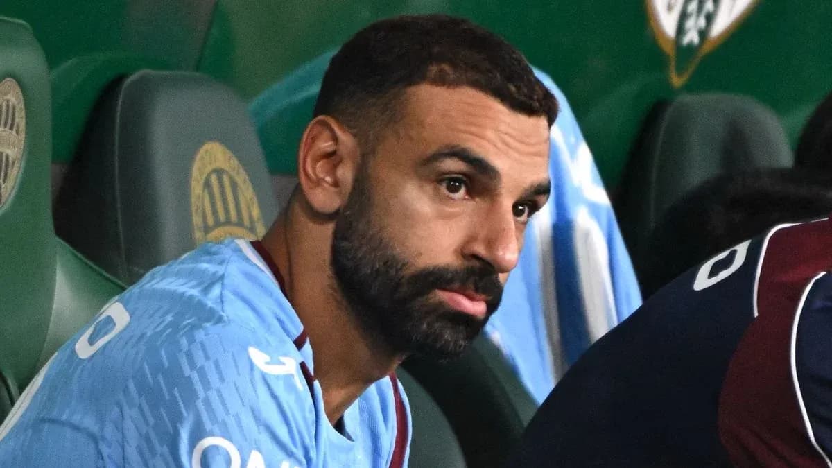 Player sitting on bench during a match Player sitting on bench during a match