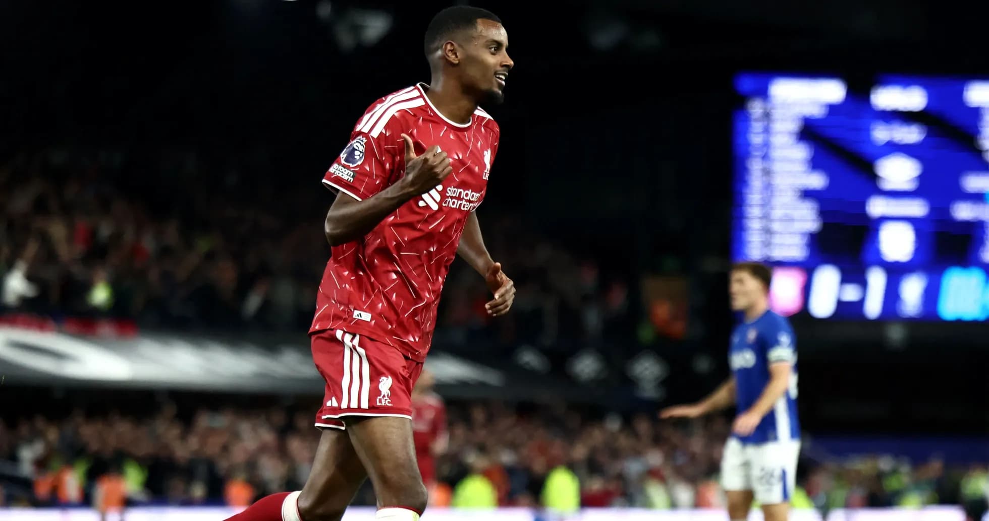 Liverpool player celebrating after scoring a goal Liverpool player celebrating after scoring a goal
