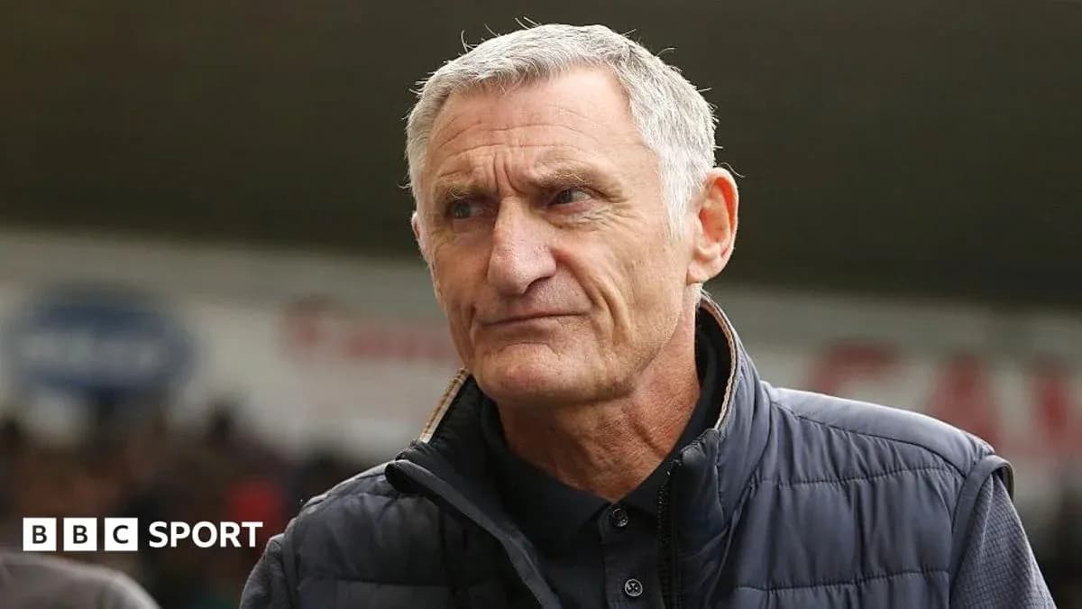 Manager in a sports venue during a match Manager in a sports venue during a match