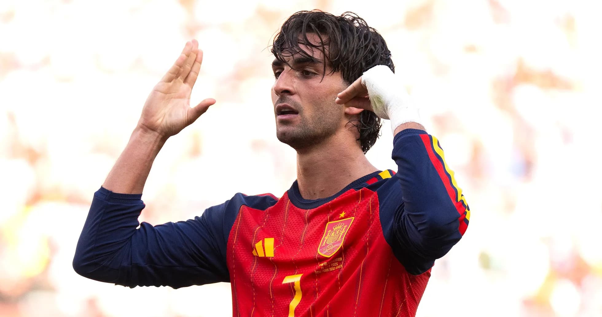 Player gesturing during match, wearing Spain jersey Player gesturing during match, wearing Spain jersey