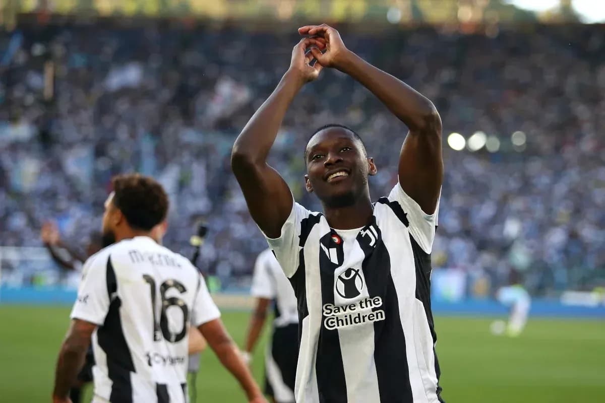 Player celebrating with fans after a match Player celebrating with fans after a match