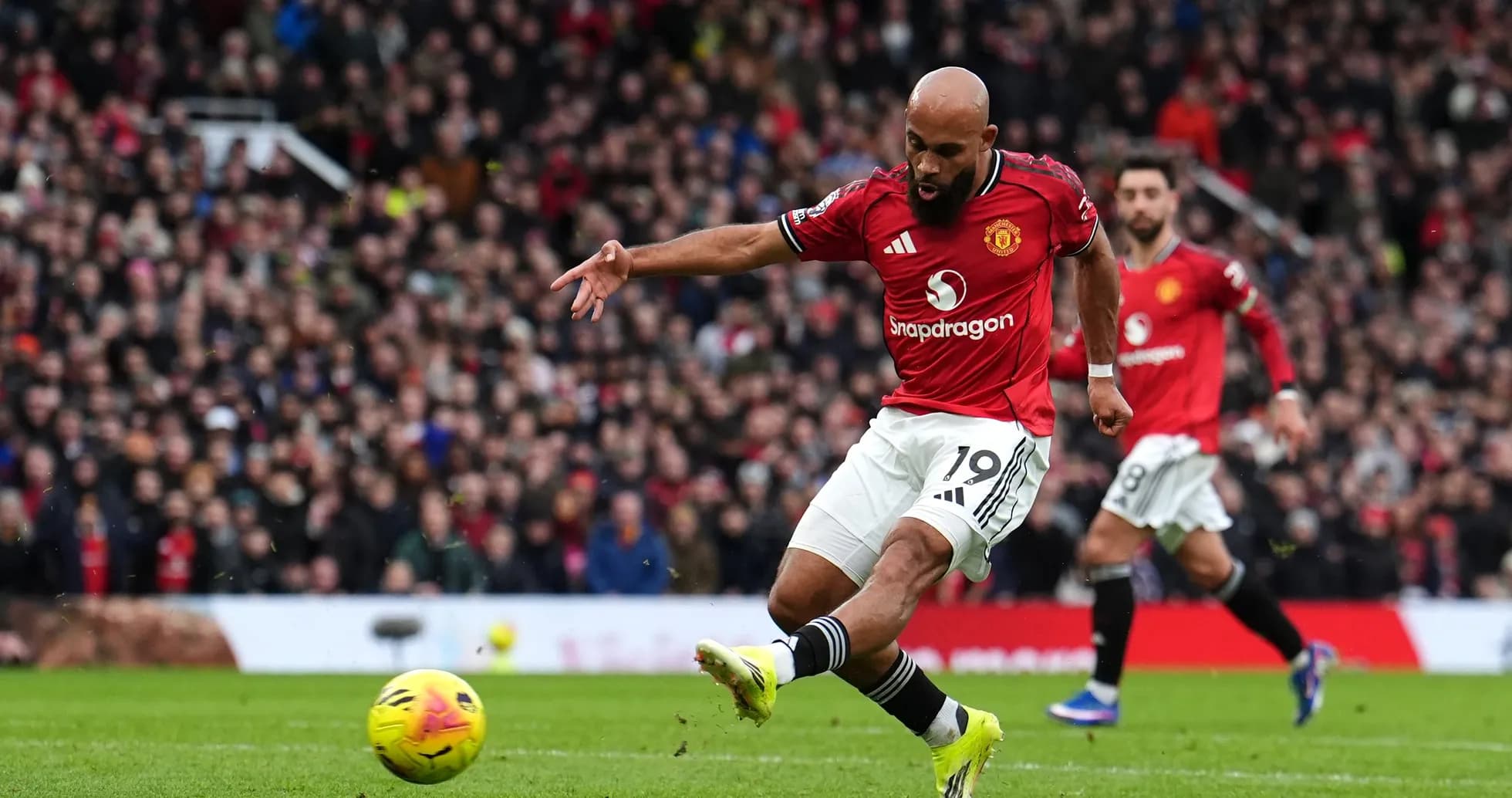Manchester United player shooting during match Manchester United player shooting during match