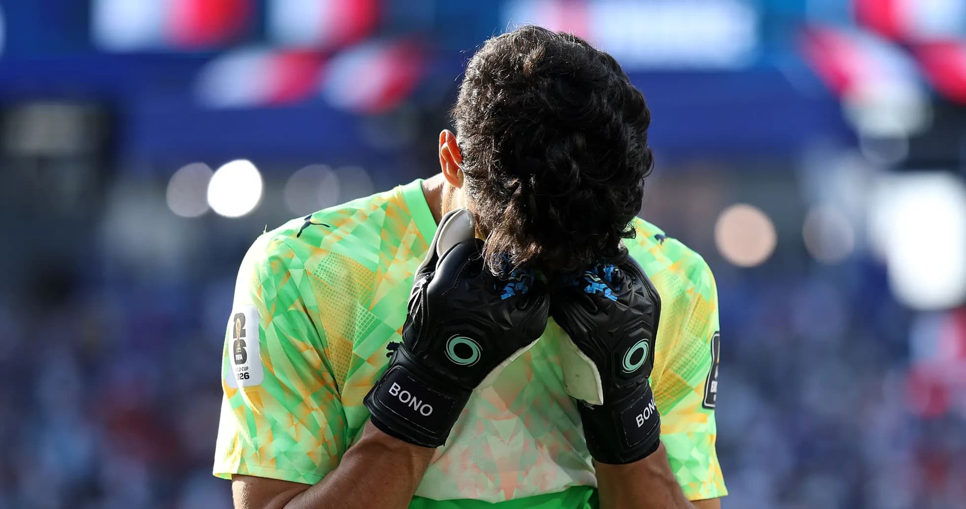 Goalkeeper holding head in hands on field Goalkeeper holding head in hands on field