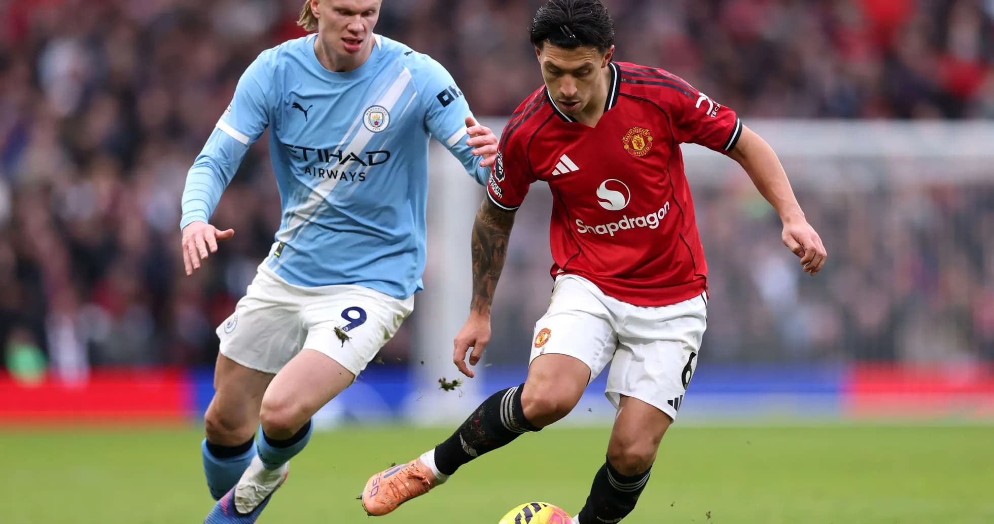 Player dribbling the ball during Manchester derby Player dribbling the ball during Manchester derby