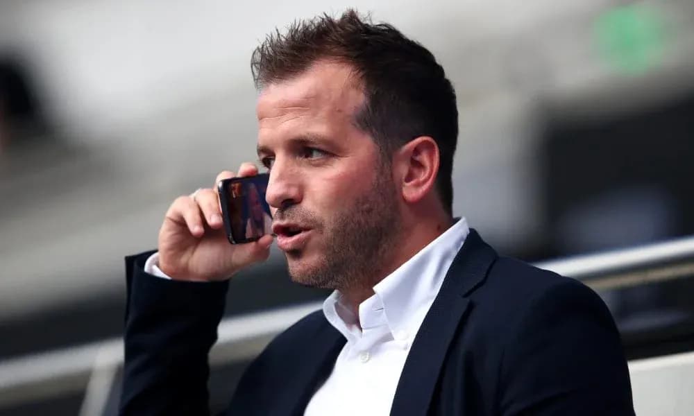Person talking on the phone in a stadium Person talking on the phone in a stadium