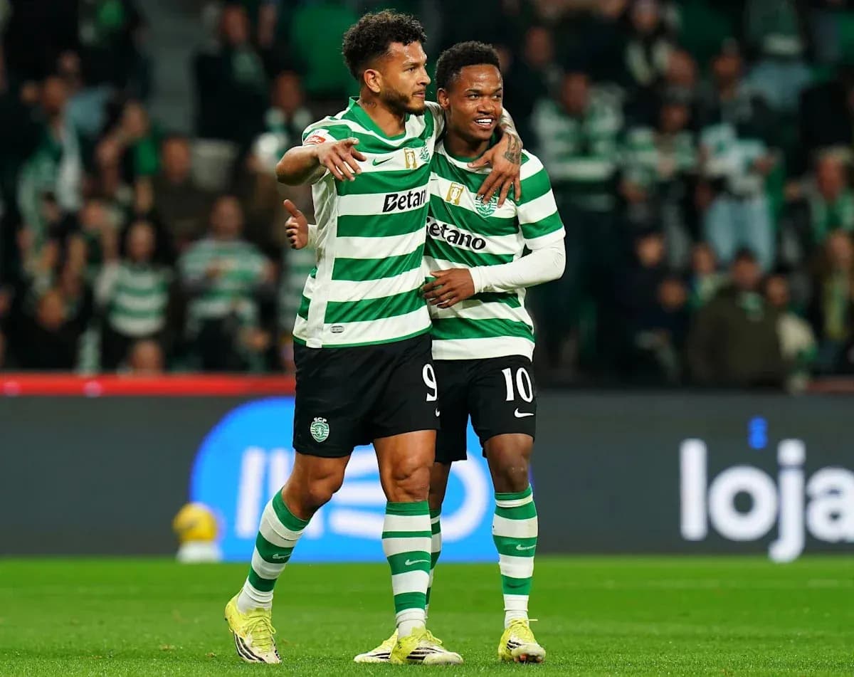Two Sporting CP players celebrating on the field Two Sporting CP players celebrating on the field
