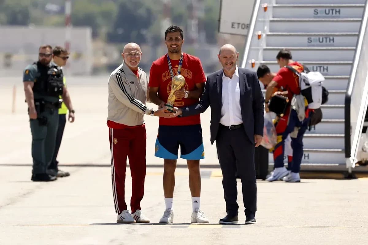 Player holding trophy with officials at airport Player holding trophy with officials at airport