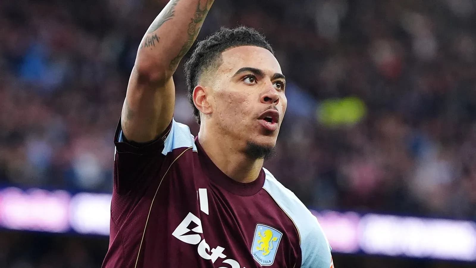 Aston Villa player celebrating during a match Aston Villa player celebrating during a match