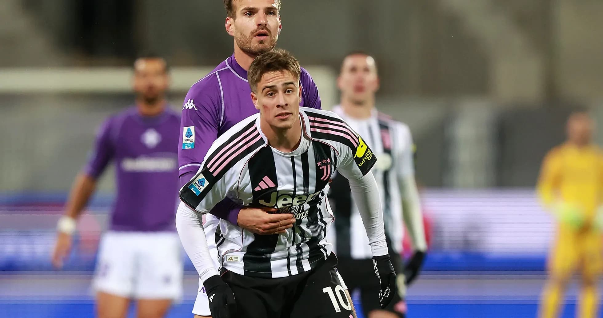 Juventus player being challenged by Fiorentina goalkeeper Juventus player being challenged by Fiorentina goalkeeper