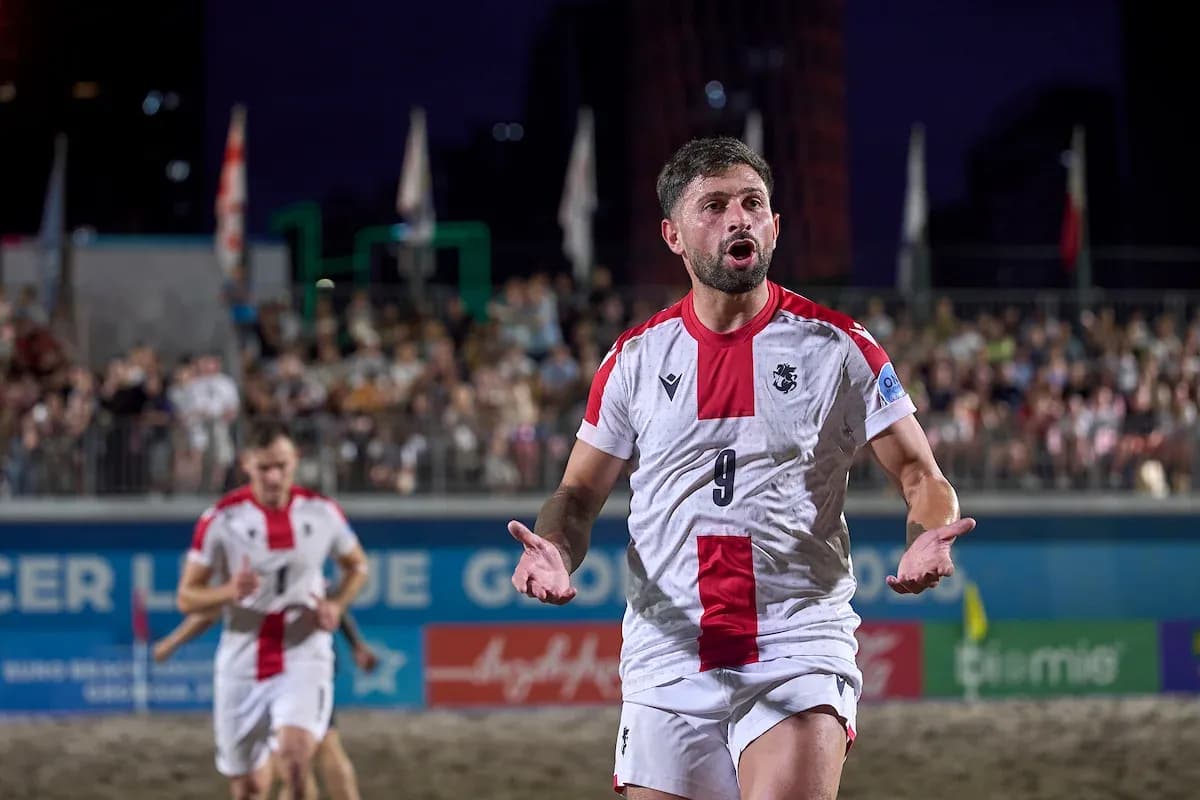 Player gesturing during beach soccer match Player gesturing during beach soccer match