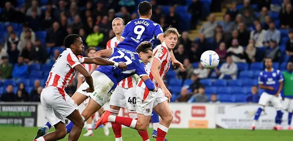 Player jumping to head the ball during match Player jumping to head the ball during match