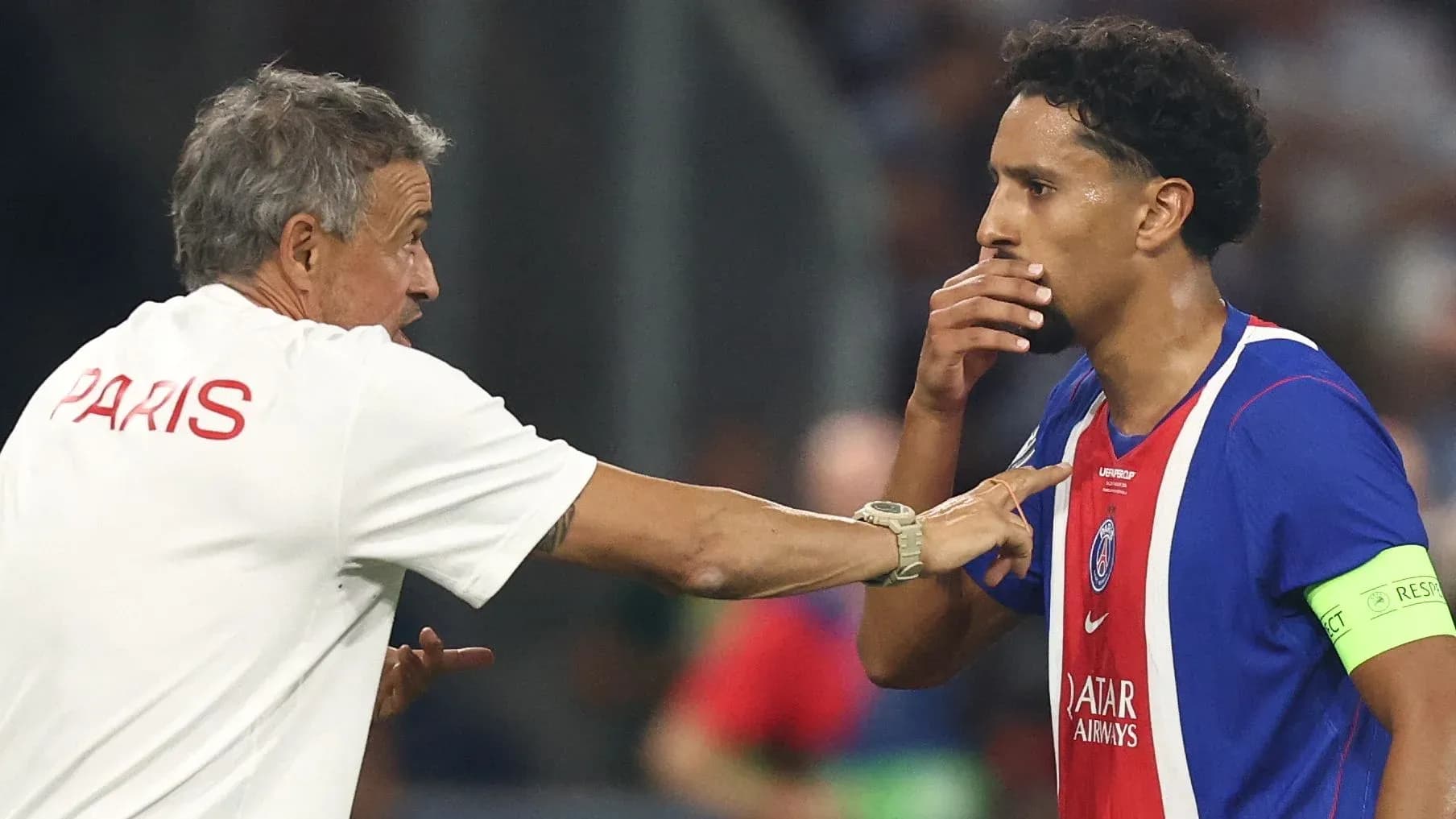 Coach instructing player during match at PSG Coach instructing player during match at PSG
