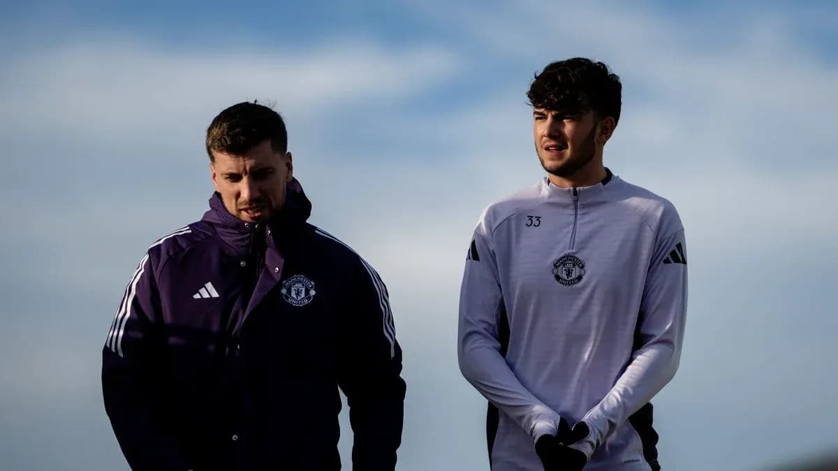 Two Manchester United players walking together outdoors Two Manchester United players walking together outdoors