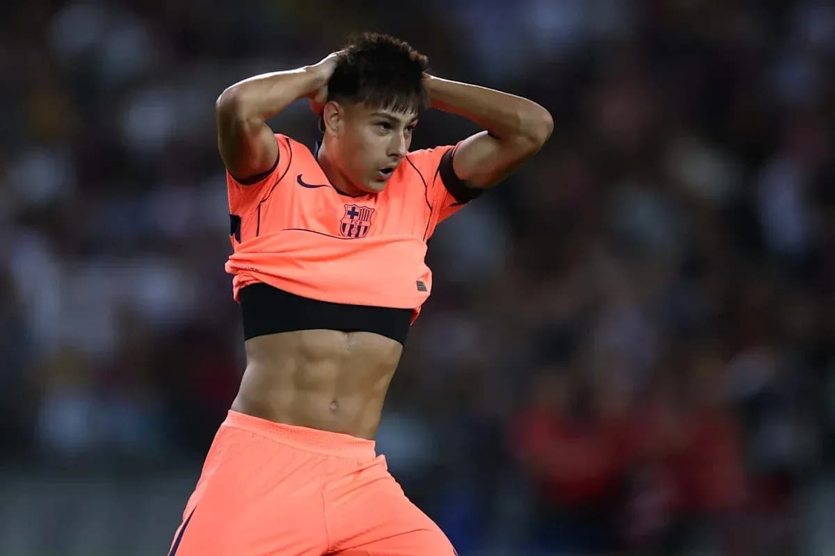Player adjusting jersey during a match Player adjusting jersey during a match