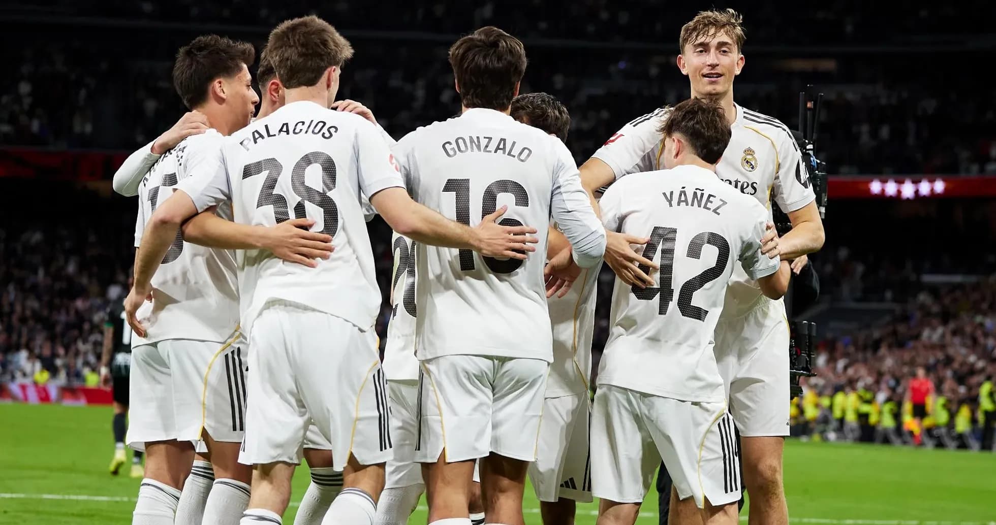 Real Madrid players celebrating a goal Real Madrid players celebrating a goal