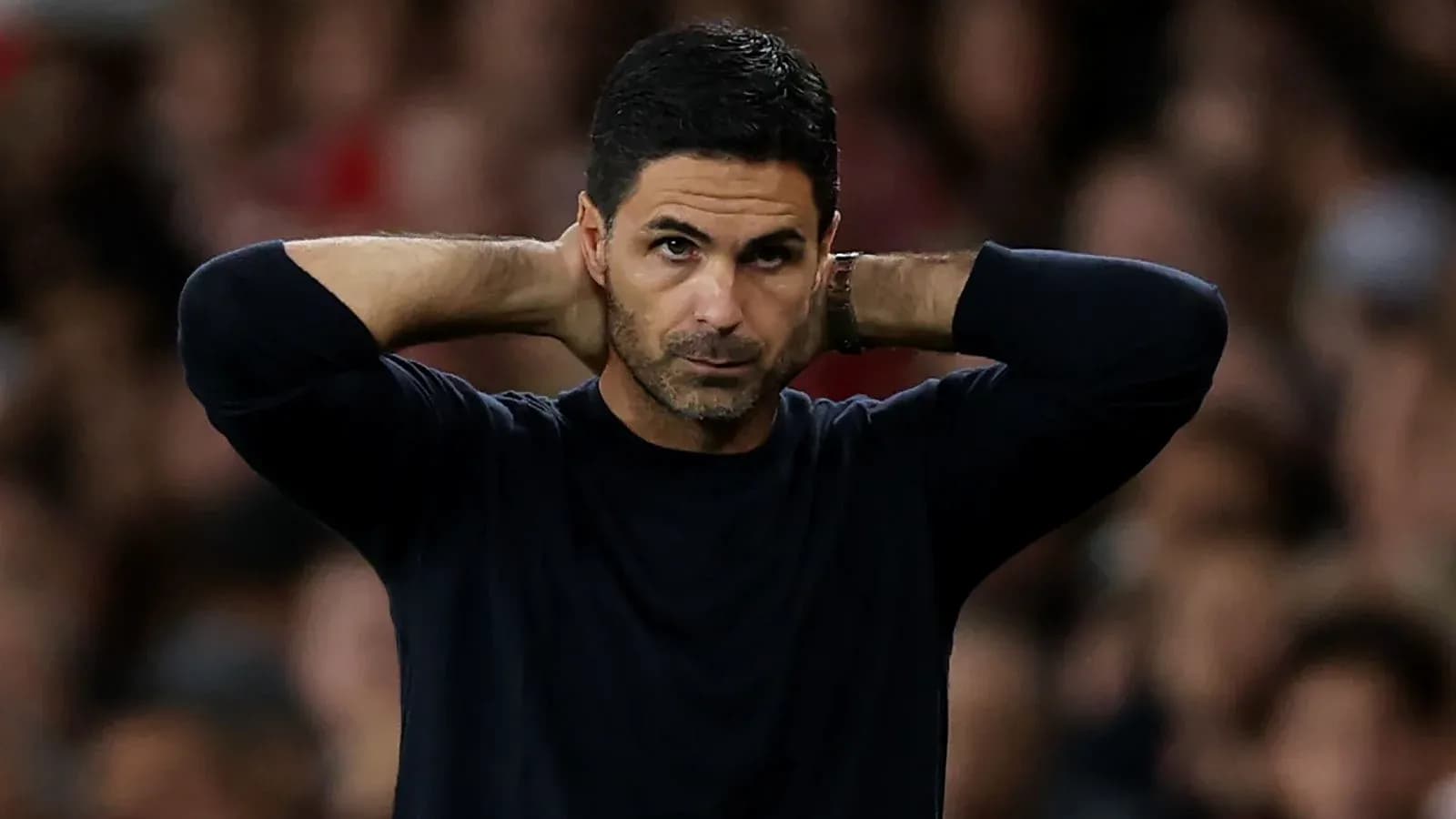 Manager with hands on head during match Manager with hands on head during match
