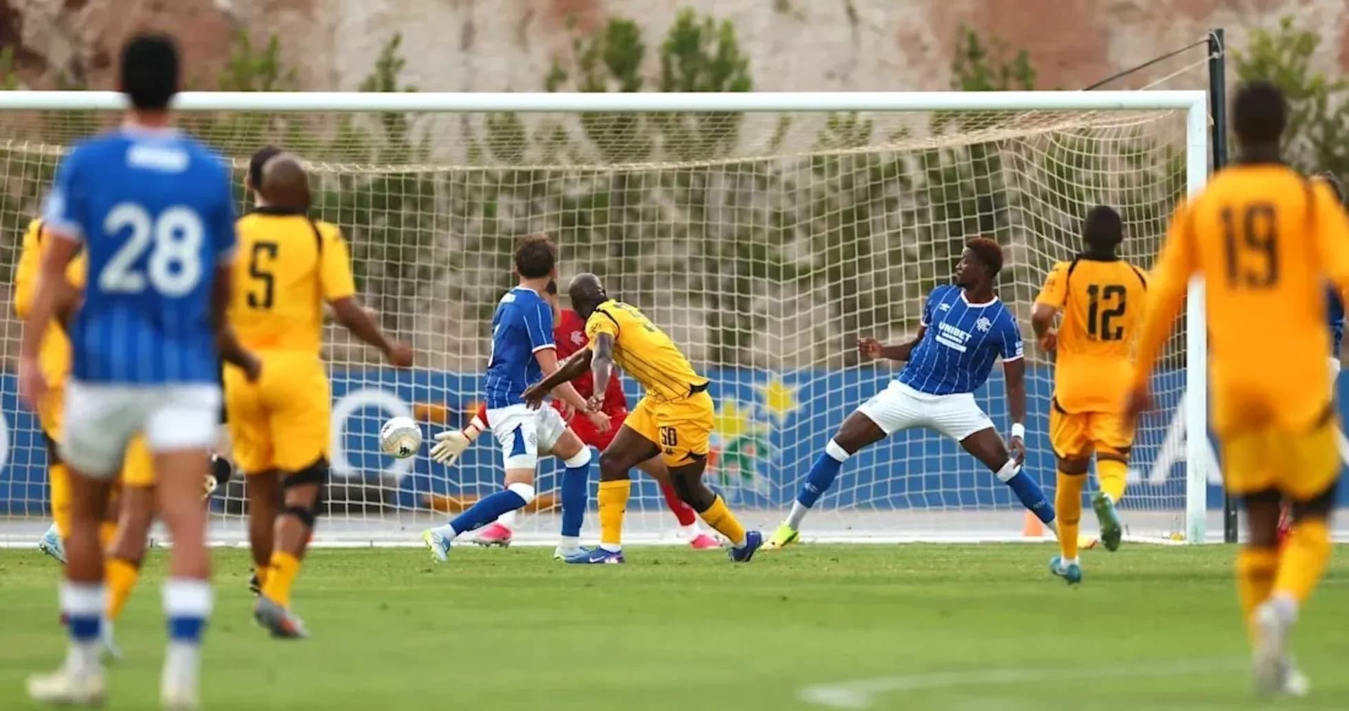 Player attempting to score during soccer match Player attempting to score during soccer match