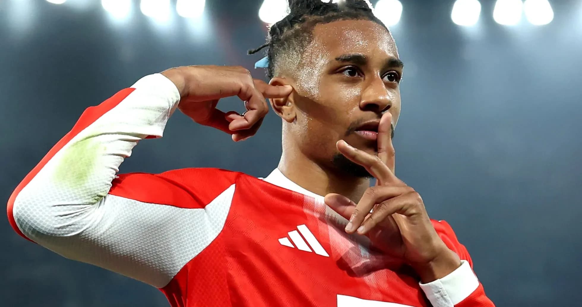 Player celebrating with shushing gesture after scoring Player celebrating with shushing gesture after scoring