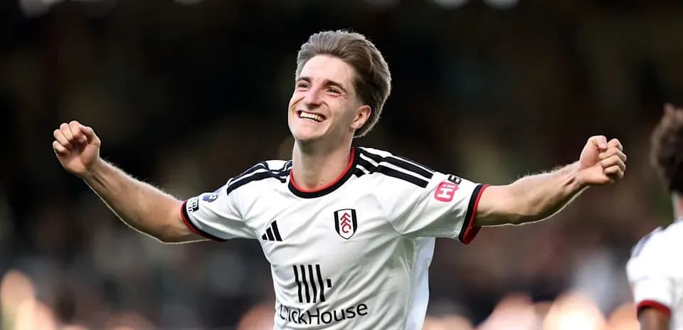 Fulham player celebrating a goal on the field Fulham player celebrating a goal on the field